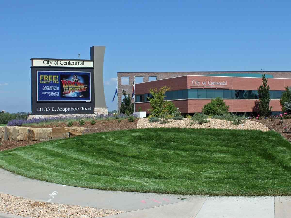 Building and sign with the city name on it for article Centennial Colorado for newcomers moving to Denver or moving within the Denver area.