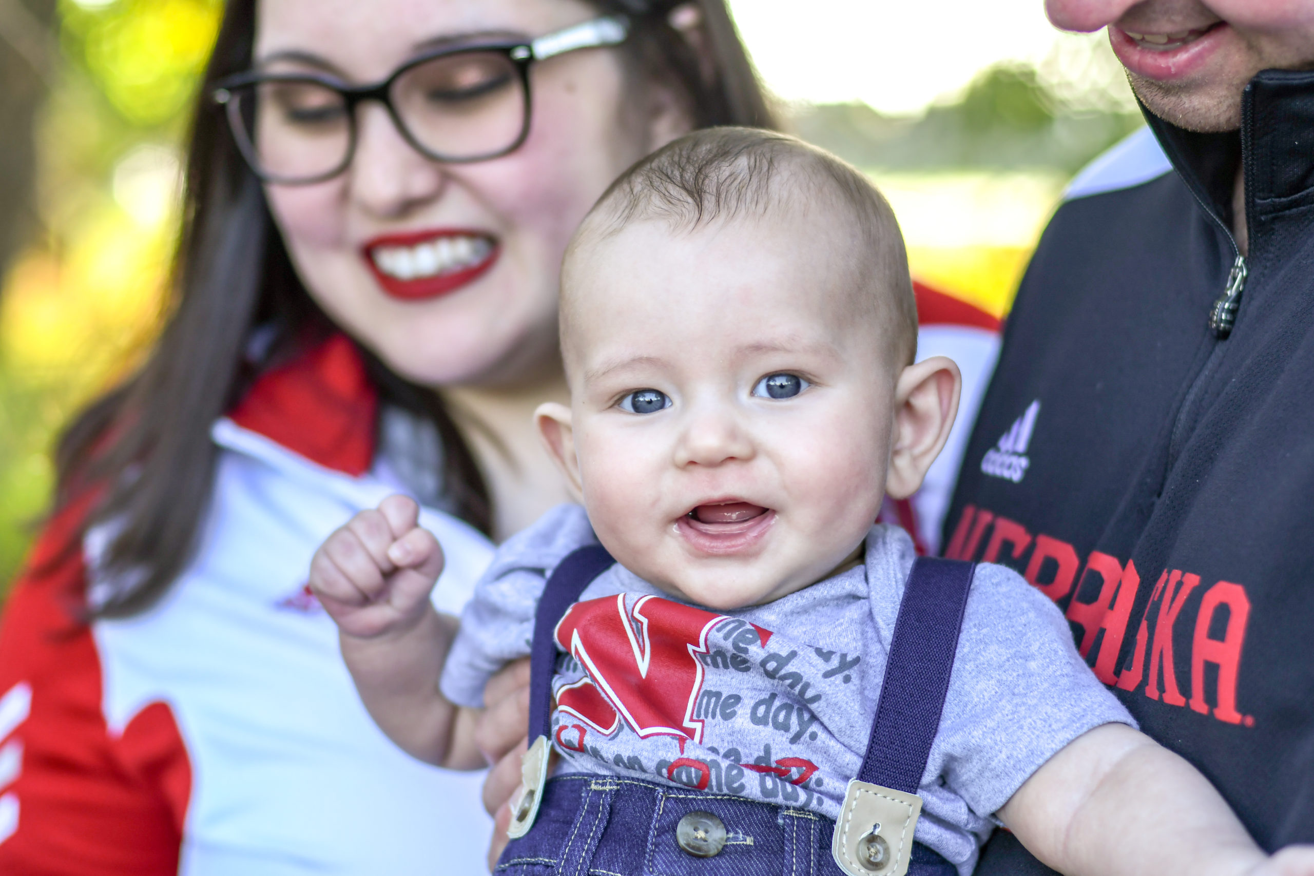 Couple holding baby for article Unlocking 6 Trusted Child Care Resources in Denver for newcomers moving to Denver.