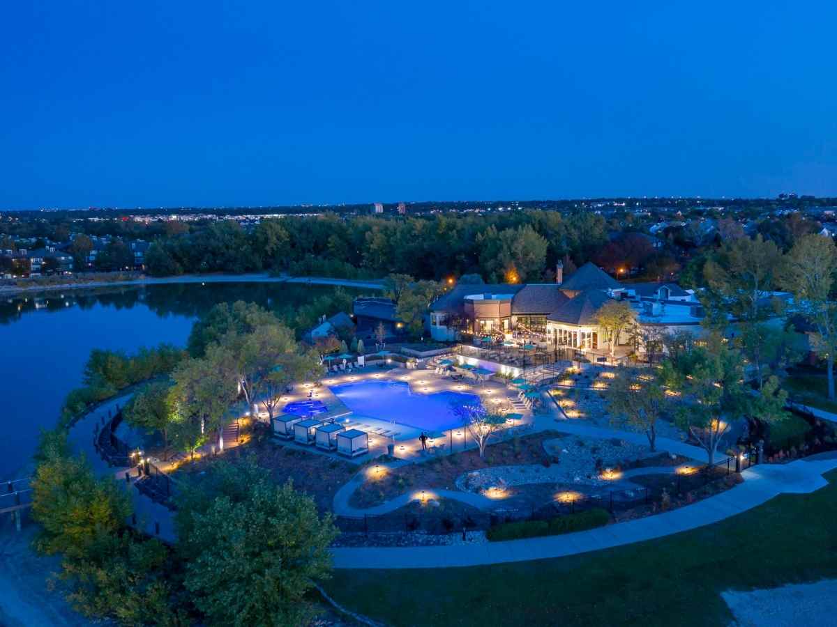 Aerial view of TAVA Waters in the evening for article Apartments in Denver for newcomers moving to the Denver area.