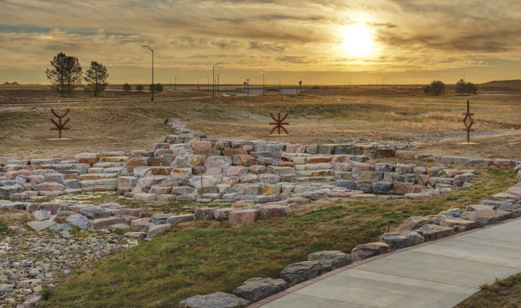 view rocks and sculptures along path at The Aurora Highlands