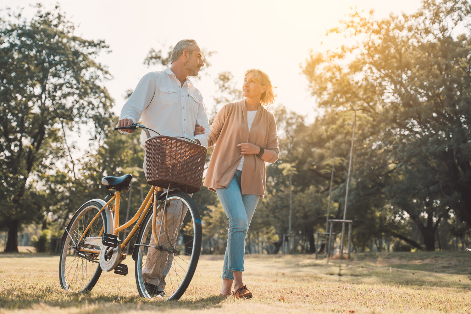 Department Image: BE WELL. Mature couple walking on trails.