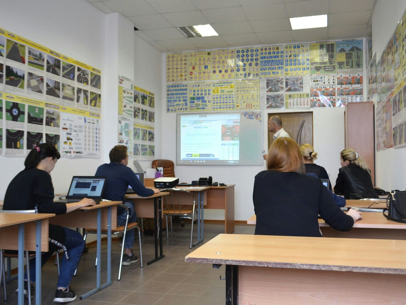 students in a classroom listening to a professor