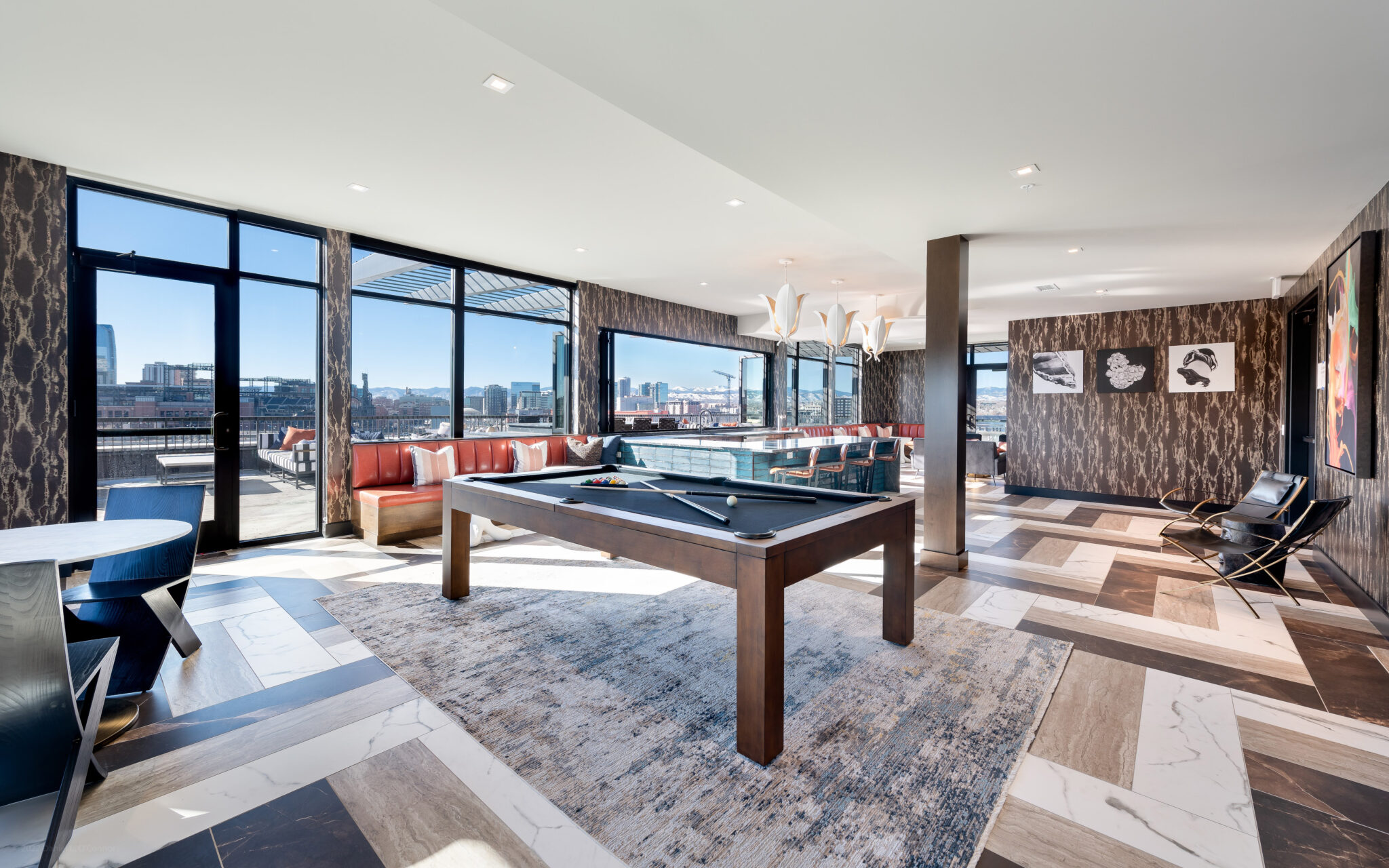 Modern apartment community room with pool table.