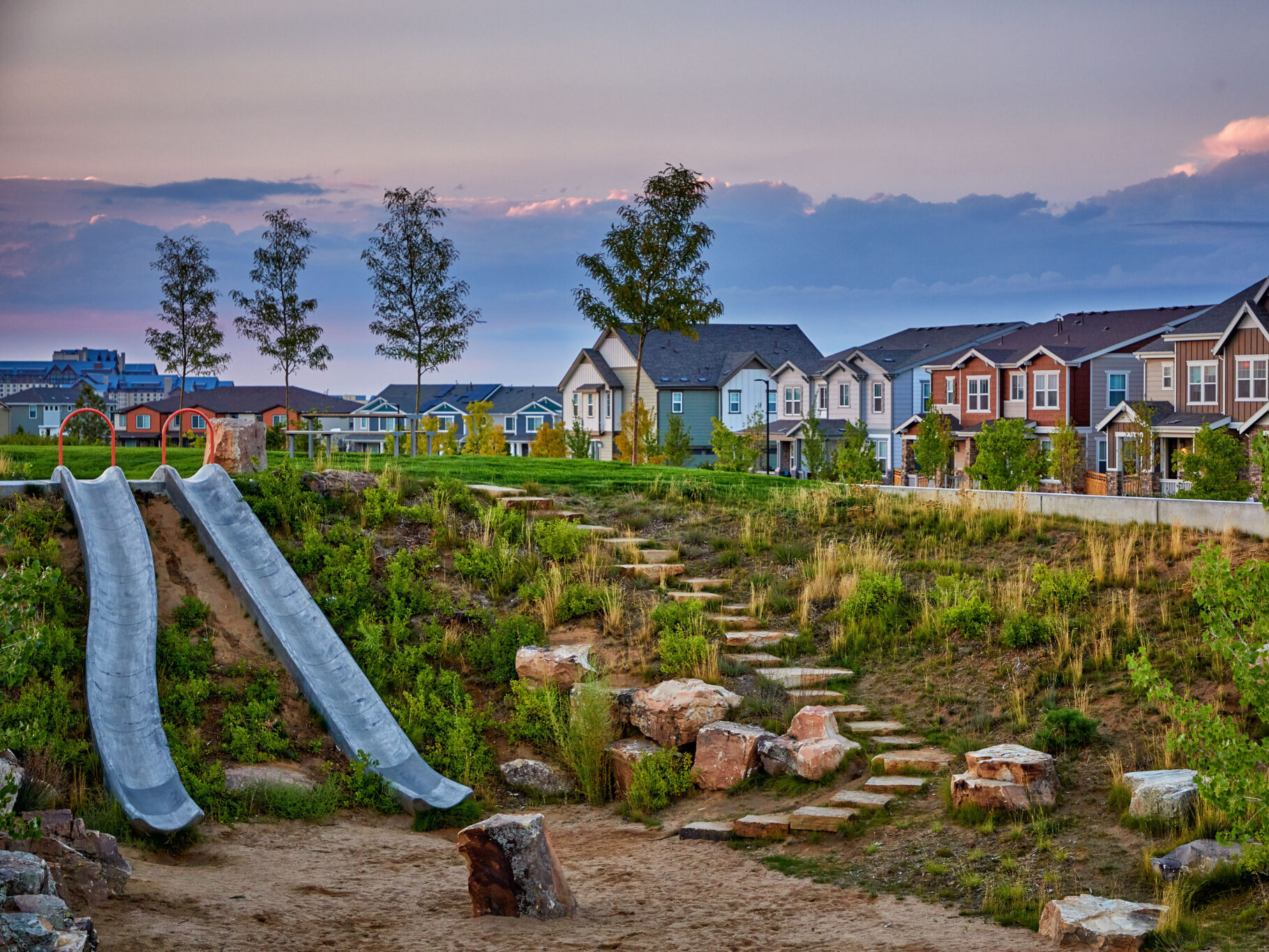 Pocket park in Painted Prairie with slides built into landscape.