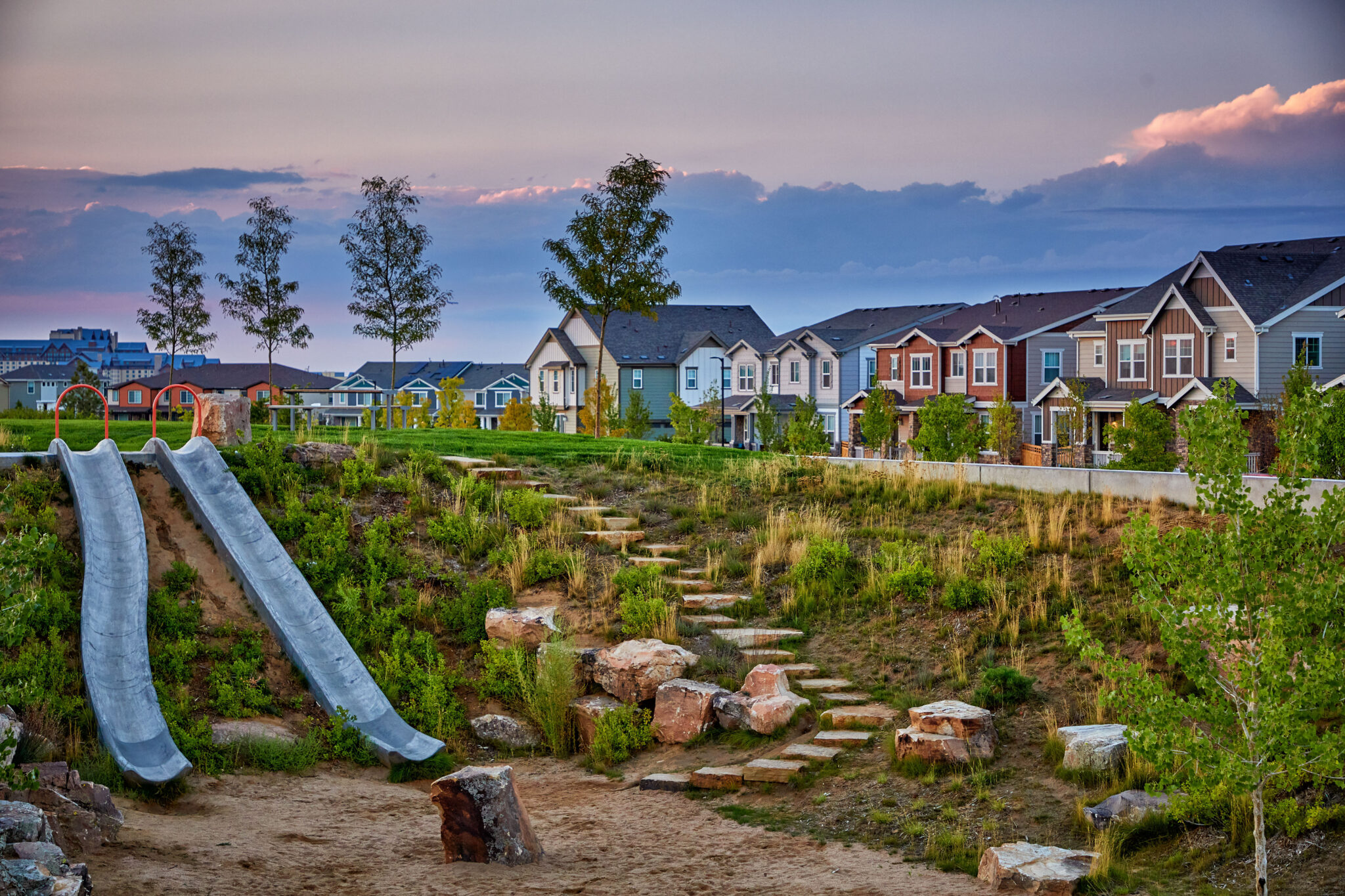 Pocket park in Painted Prairie with slides built into landscape.