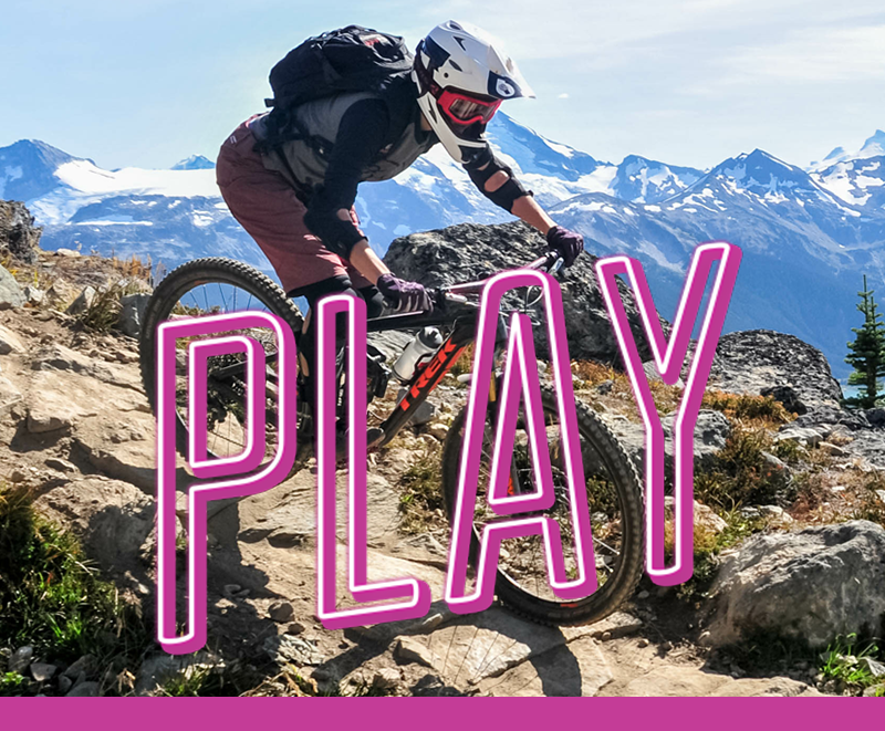 Department Image: PLAY. Man riding his bike down mountain side