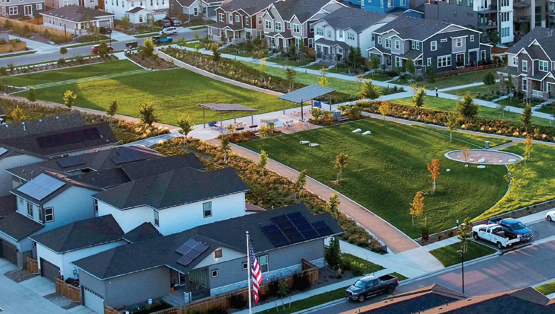 Outdoor open areas with foot paths between housing at Painted Prairie.