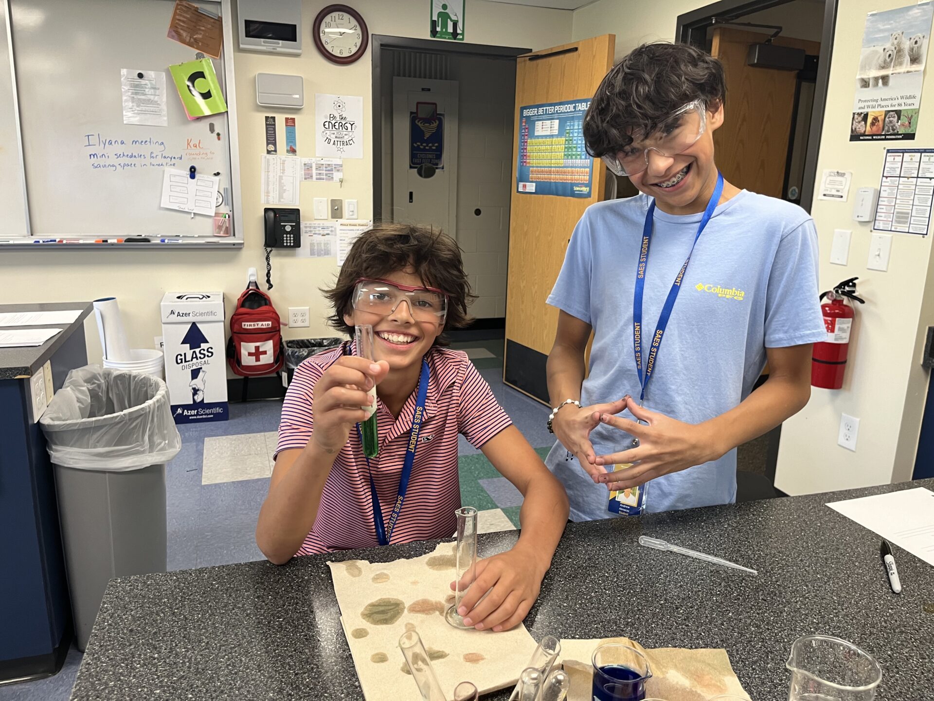 2 St Anne's students in lab classroom with protective eyewear on.