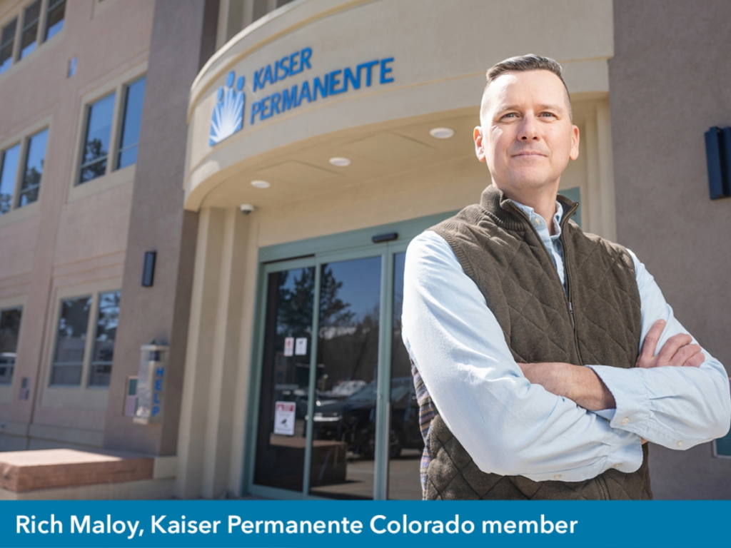 State-of-the-heart care at Kaiser Permanente - A gentleman, Rich, is standing in front of Kaiser Permanente building with arms crossed looking at camera. Words at bottom say, "Rich Maloy, Kaiser Permanente Colorado Member".