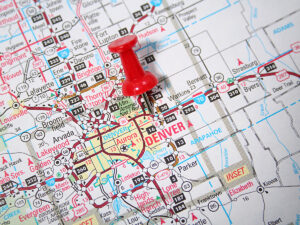 Map of Colorado zoomed into Denver area with a red push pin in Denver for article Where is Denver Located? for newcomers moving to Denver.