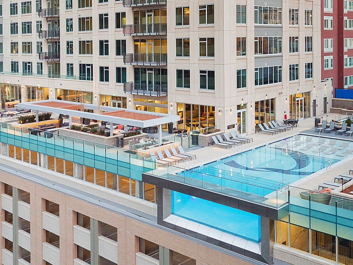 The Quincy Apartments - luxury apartments in Denver - Glass-sided pool, 8 stories up for article - The 10 Top Luxury and Most Expensive Apartments in Denver for newcomers moving to Denver.