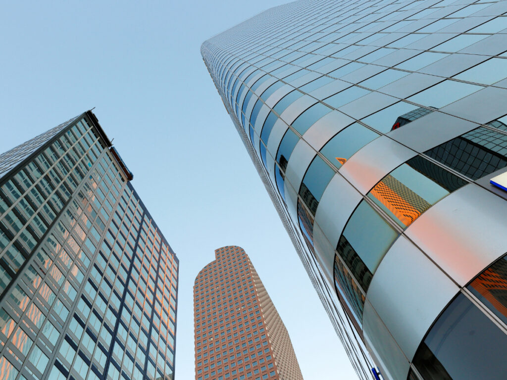 Closeup shot looking up at Downtown Denver skyscrapers for article Top 10 Companies Headquartered in Denver for newcomers moving to Denver.