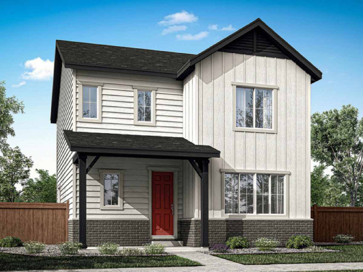 2 Story home neutral in color with a red door and brown fence out from sides of house and perfectly landscaped from yard for article Painted Prairie is Blossoming for newcomers moving to Denver.