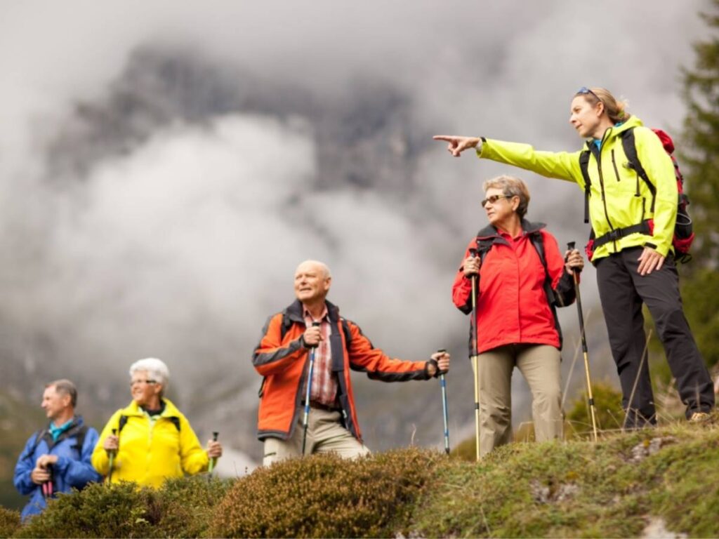 Group of seniors being led on a hike in Colorado for article Day Trips for Seniors Near Denver: 8 Rewarding Escapes for newcomers retiring to Denver.