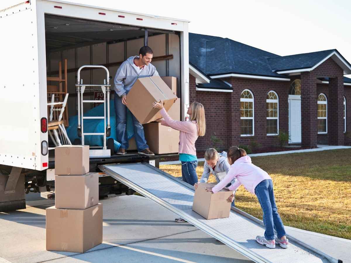 Family of 4 packing up moving van for article Cost of Moving to Denver in 2025: What to Budget For for newcomers moving to Denver.