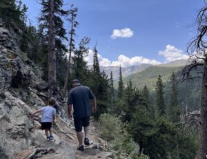 Echo Lake - man and child hiking things to do in Colorado over labor day weekend